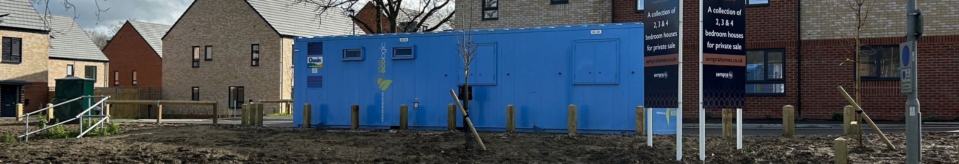 Oasis unit located by residential buildings.
